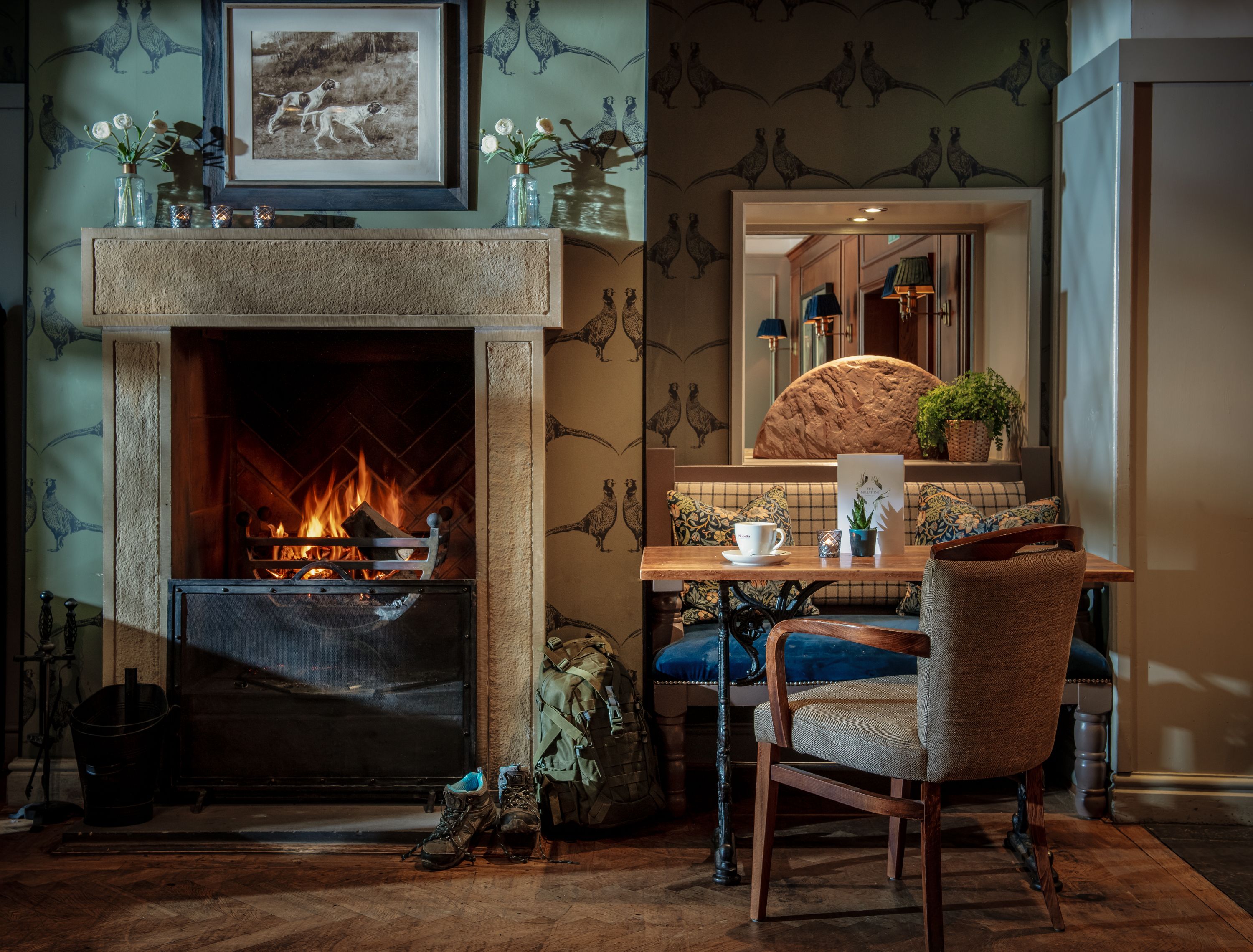 stone fireplace in bar area at the millstone