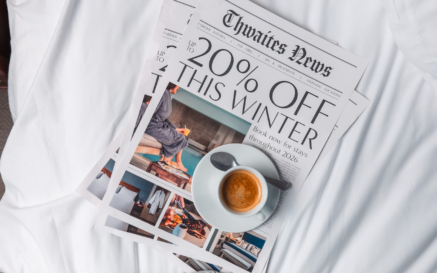 "up to 20% off this winter" newspaper with coffee cup on bed