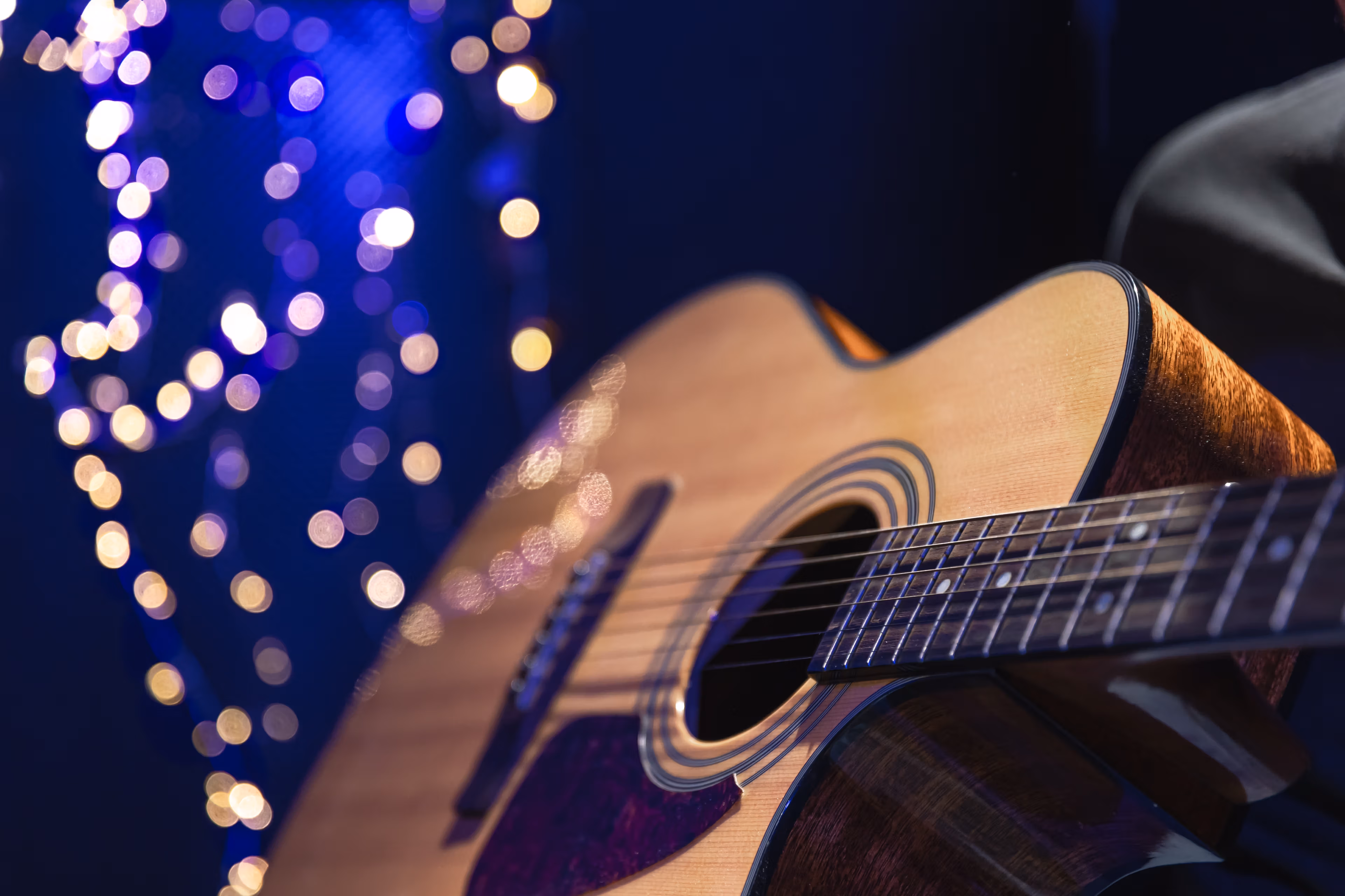 acoustic guitar with twinkling lights